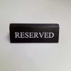 RISERVATO table sign, dark brown faux leather, white print, small